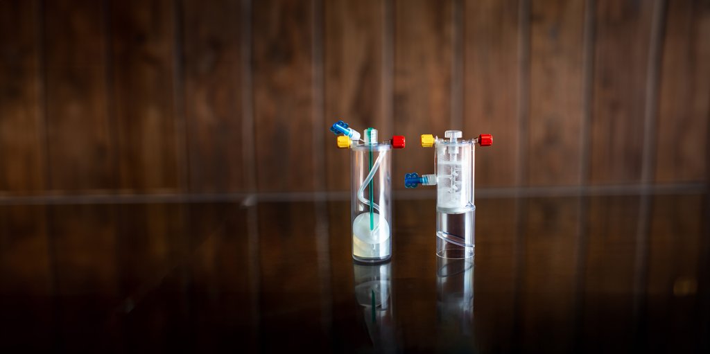 Two equine regenerative medicine blood-processing devices displayed in a veterinary setting.